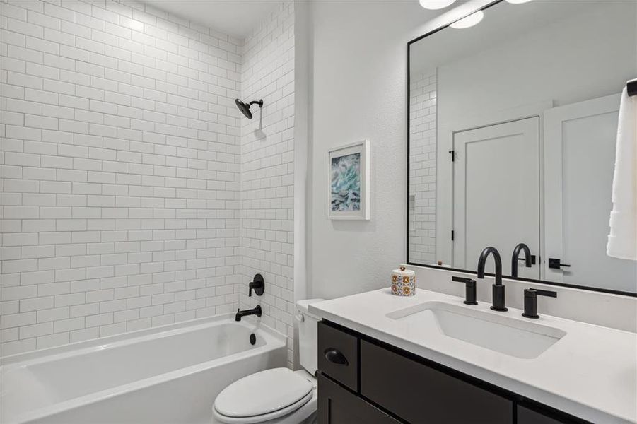 Secondary Bathroom. Representative photo from a similar home completed by the builder, Homebound.25236119Ellsworth023