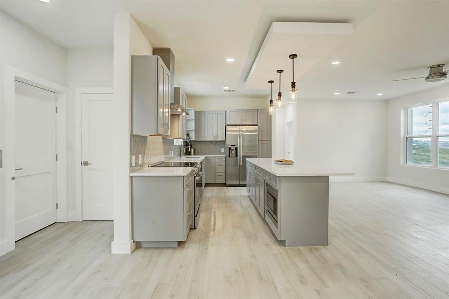 Elevator comes into the the left side of the kitchen in floor plan A.