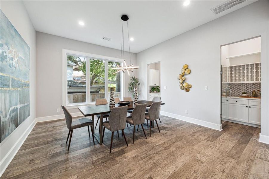 Formal Dining Room with a  fitted wine room with a secure glass door