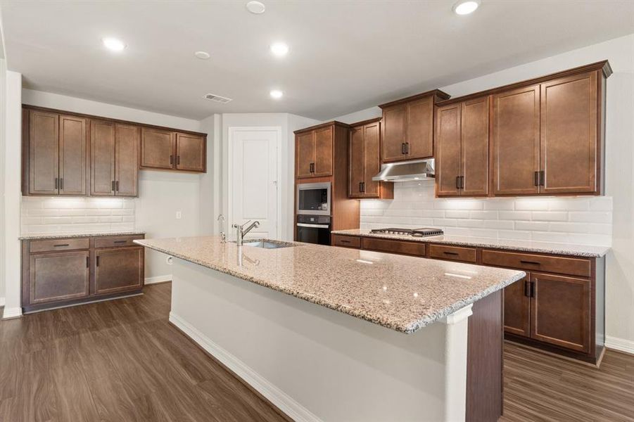 This kitchen is not only a functional space but also has ample storage. Whether you're a seasoned chef or just love to gather and enjoy good food, this kitchen is a dream come true.