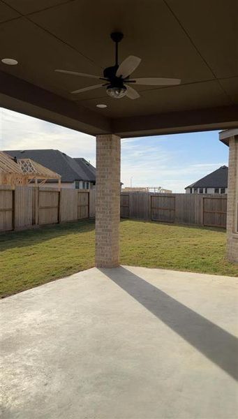 Extended outdoor patio with a ceiling fan to keep you cool on hot days!