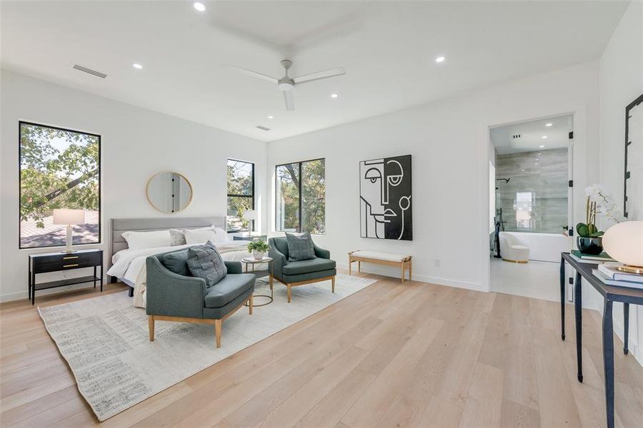 Bedroom featuring ceiling fan and light hardwood / wood-style flooring