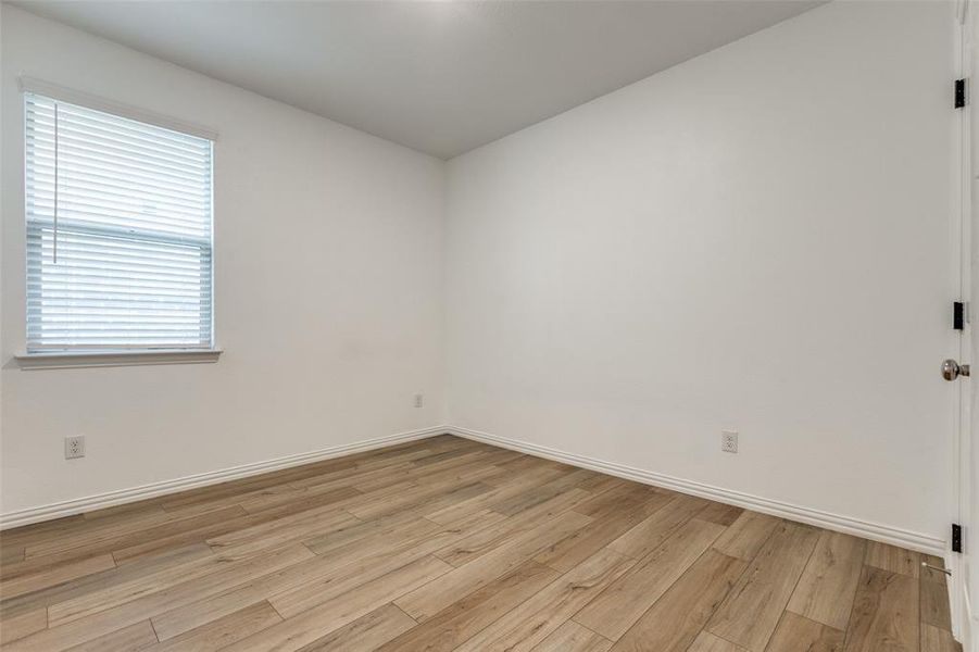 Spare room with light hardwood / wood-style flooring