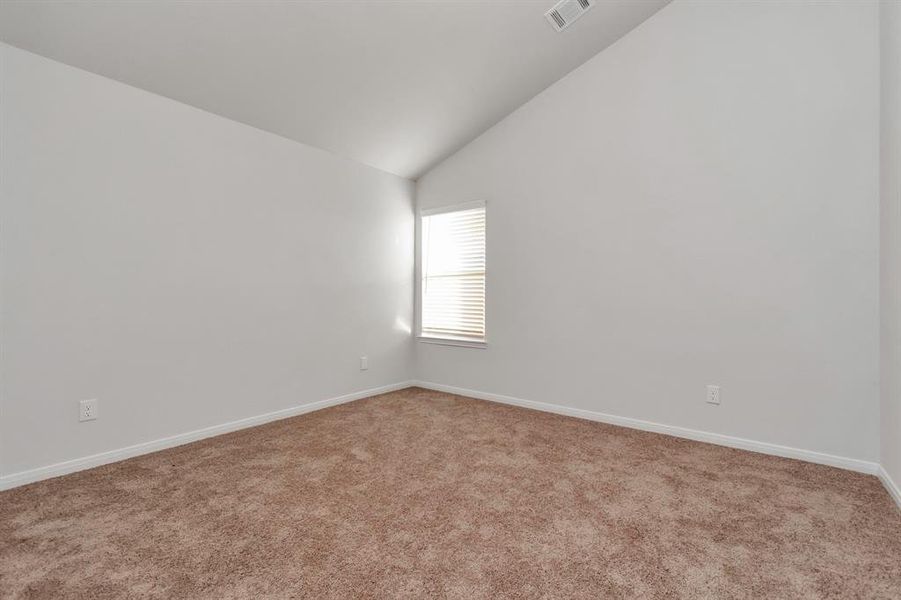 Another spacious bedroom featuring plush carpeting and ample closet space. Ideal for a guest room, office, or flex space, with versatility to suit your needs. **This image is from another Saratoga Home - Clover floorplan.**