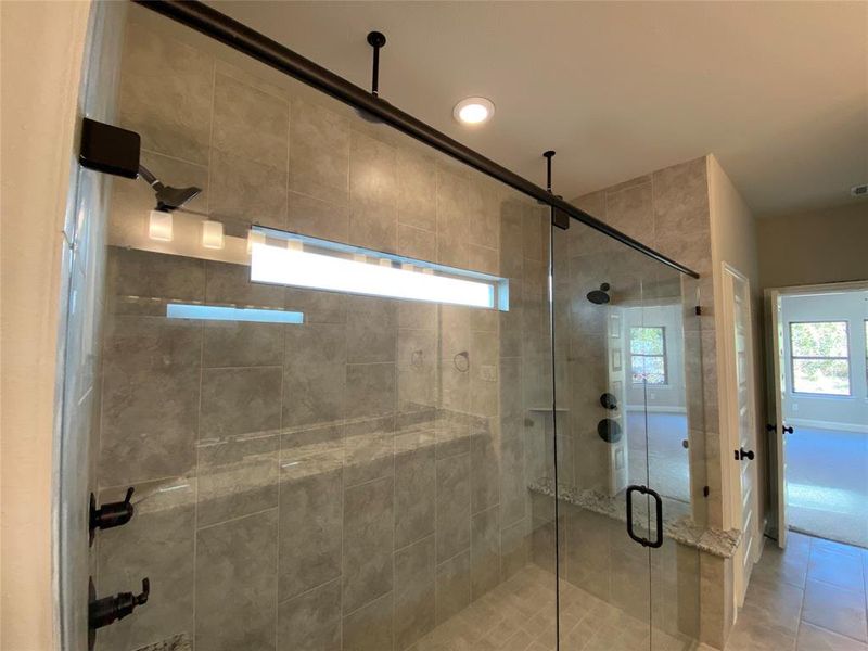 HUGE master shower with 2 rain heads, 2 shower heads (4 total,) and 2 benches