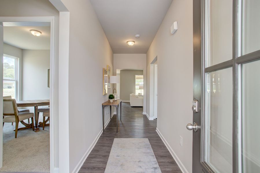 The foyer leads to the large family room and kitchen