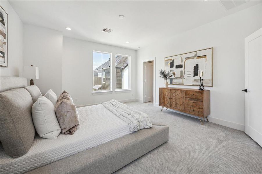 Porcelain floor tiles and glossy white subway tiles exudes luxury. Windows above the soaking tub offers natural light while maintaining privacy.