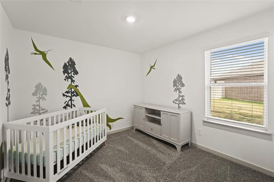 Adorable guest bedroom features high ceilings and privacy blinds