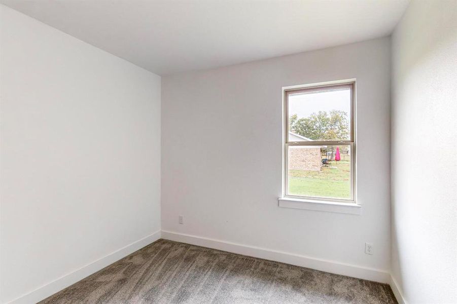 Unfurnished room featuring carpet flooring