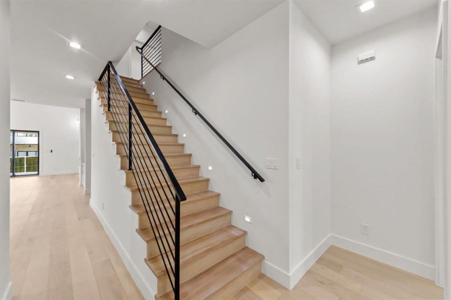 Stairway with hardwood / wood-style floors