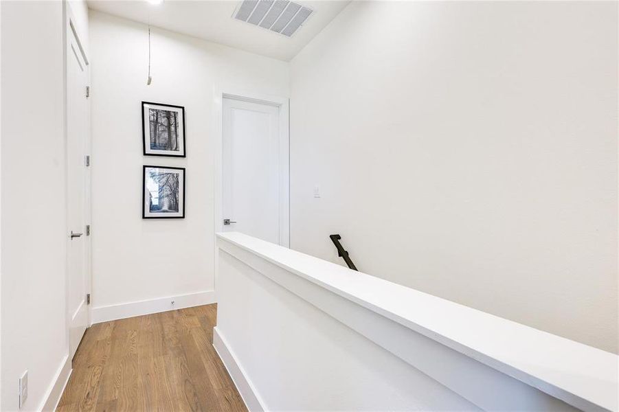 Hallway featuring hardwood / wood-style flooring