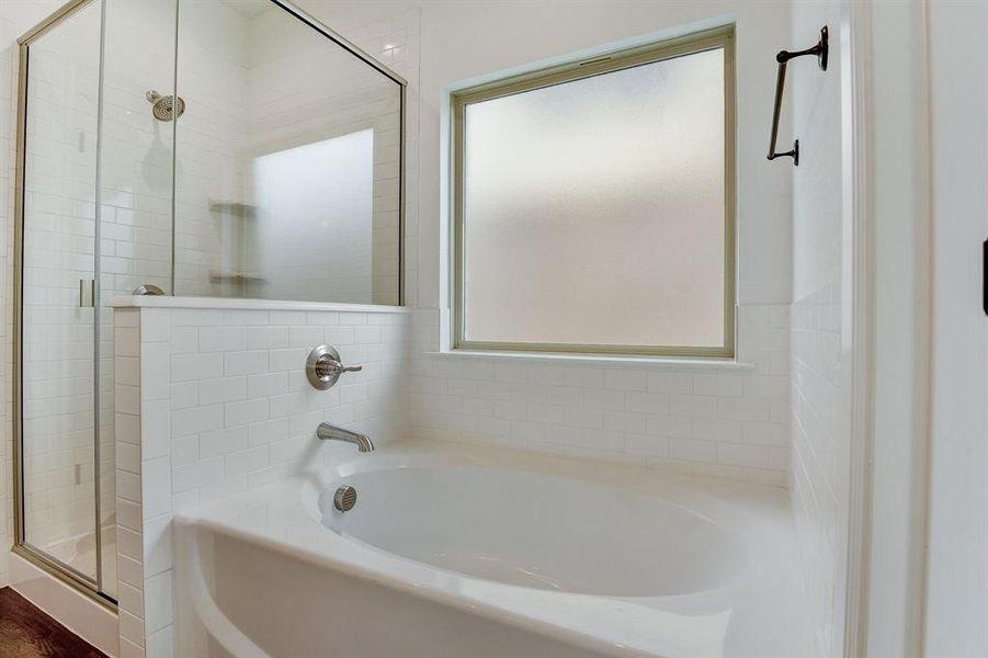 Bathroom with shower with separate bathtub