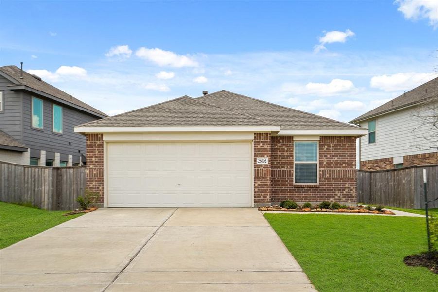 Welcome home to 26802 Wildereye Cove! This home sits on a spacious lot with ample yard space in front and the back, fresh landscaping, and well-maintained yard!