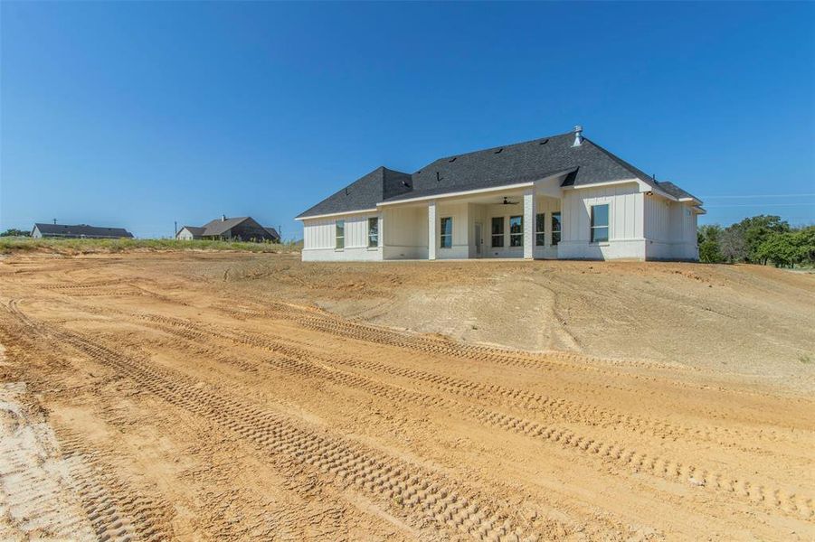 Back of property with ceiling fan