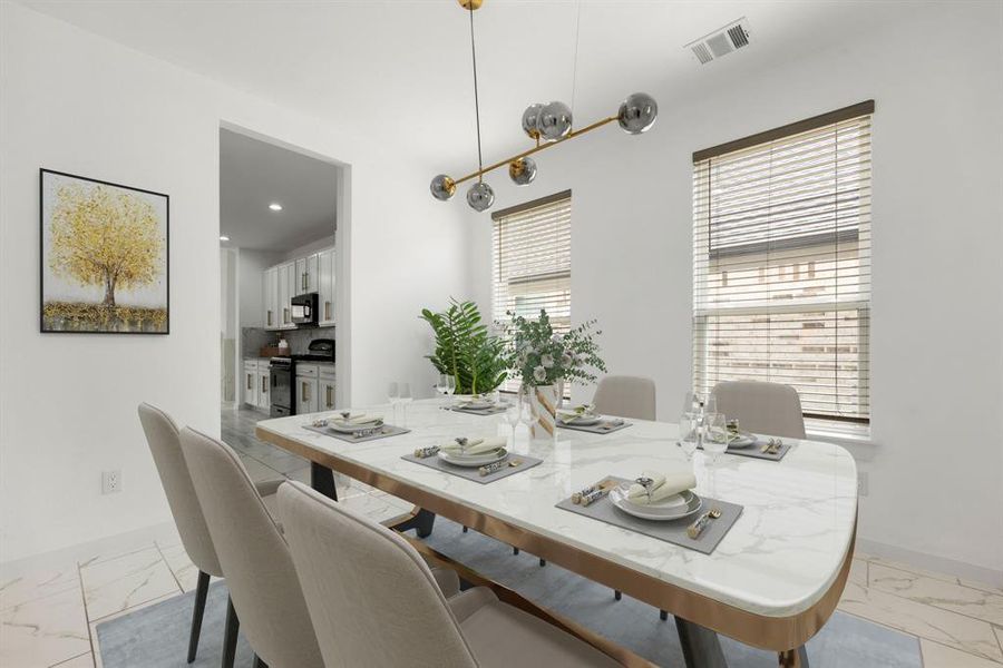 You and your guests will certainly dine in style in this amazing formal dining room! Featuring a unique modern chandelier, large windows with blinds, high ceilings, and tile flooring. Perfect space to entertain family and friends.