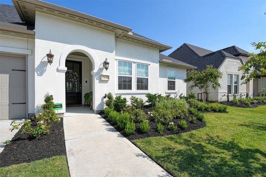 Greened and manicured front yard.