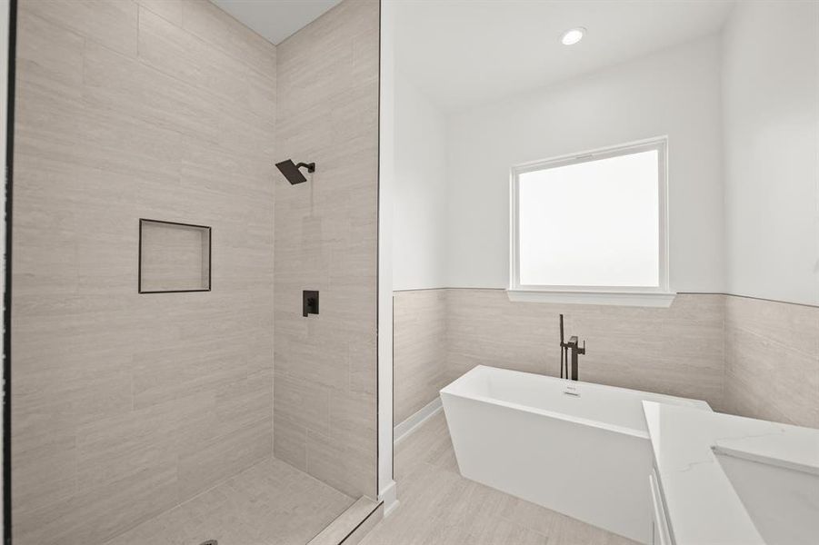 It is complete with a walk-in shower, and a stand alone tub with a privacy frozen glass. *shower glass installation coming soon* Photos are from a similar unit in the development.