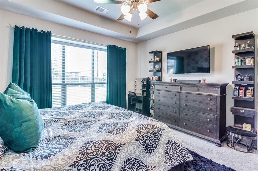 Bedroom with ceiling fan and carpet floors