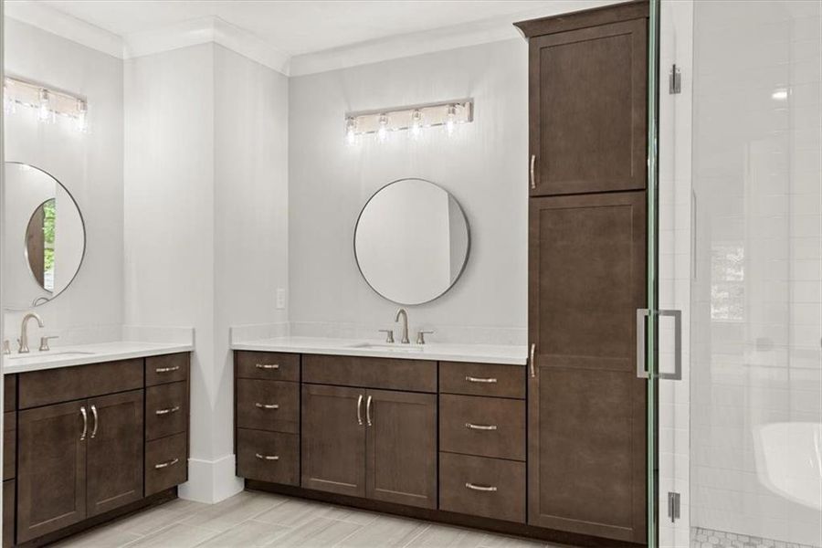 Bathroom featuring dual vanity and ornamental molding