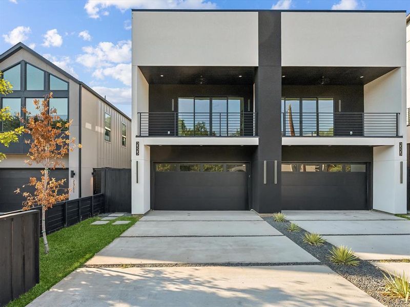 Modern home with a balcony and a garage