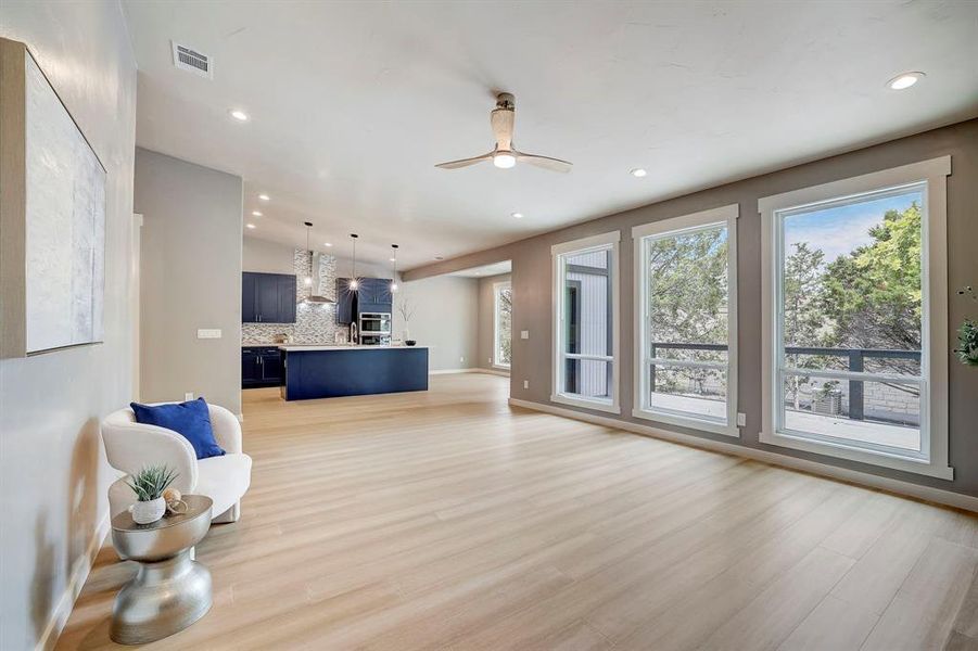 Open living room with backyard view