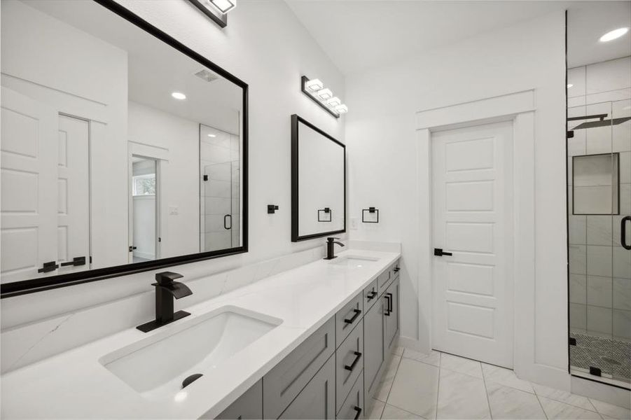 2nd floor bathroom with double sink vanity, an enclosed shower, and tile patterned flooring