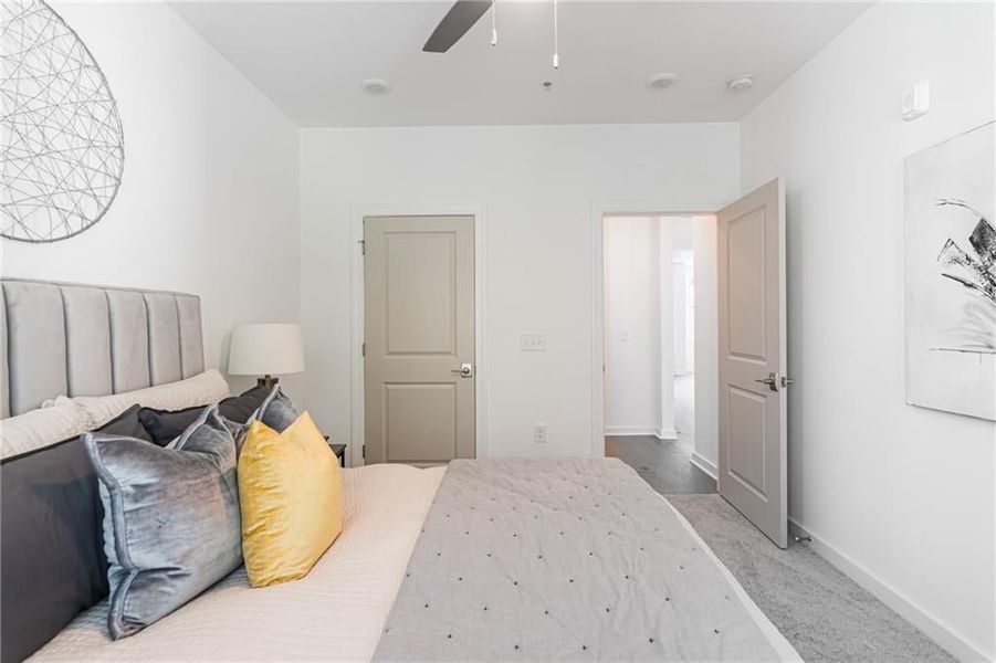 Secondary bedroom tucked away with a bathroom just outside of the door.
*Model Home-Representative purposes only*