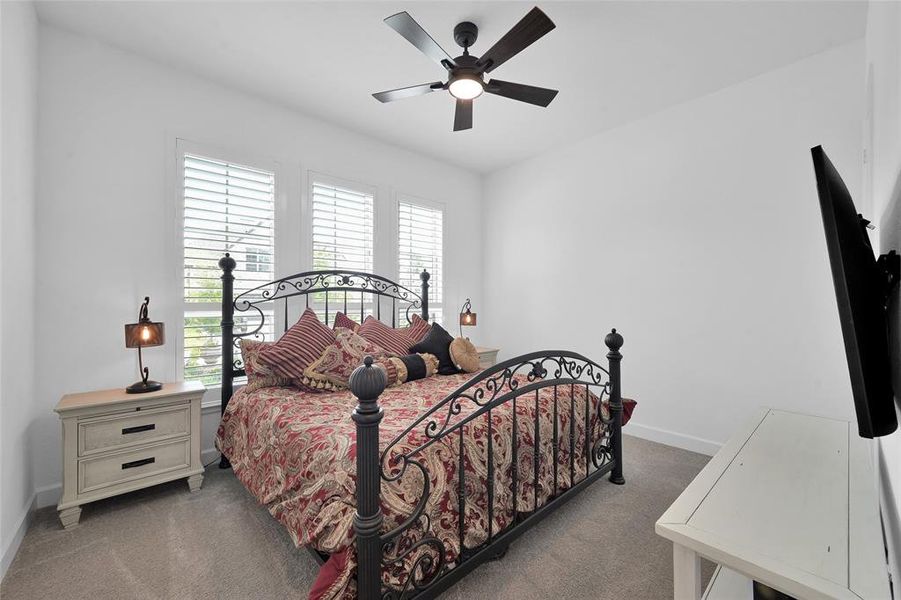 2nd bedroom showing the front windows of the house