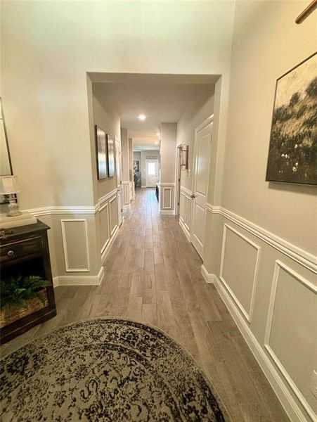 Corridor with dark hardwood / wood-style floors