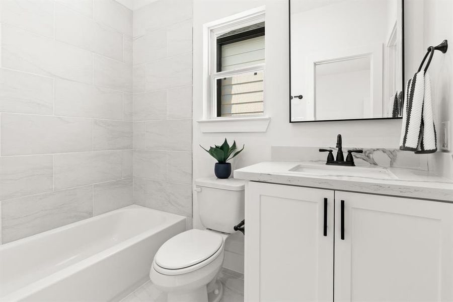 The secondary bathroom continues the same design and quality of a CMC home.