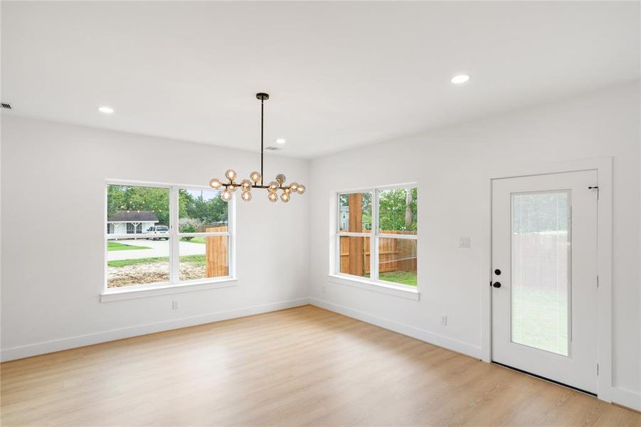 The dreamy kitchen opens up to dining room, easy access to the back yard entertainment!