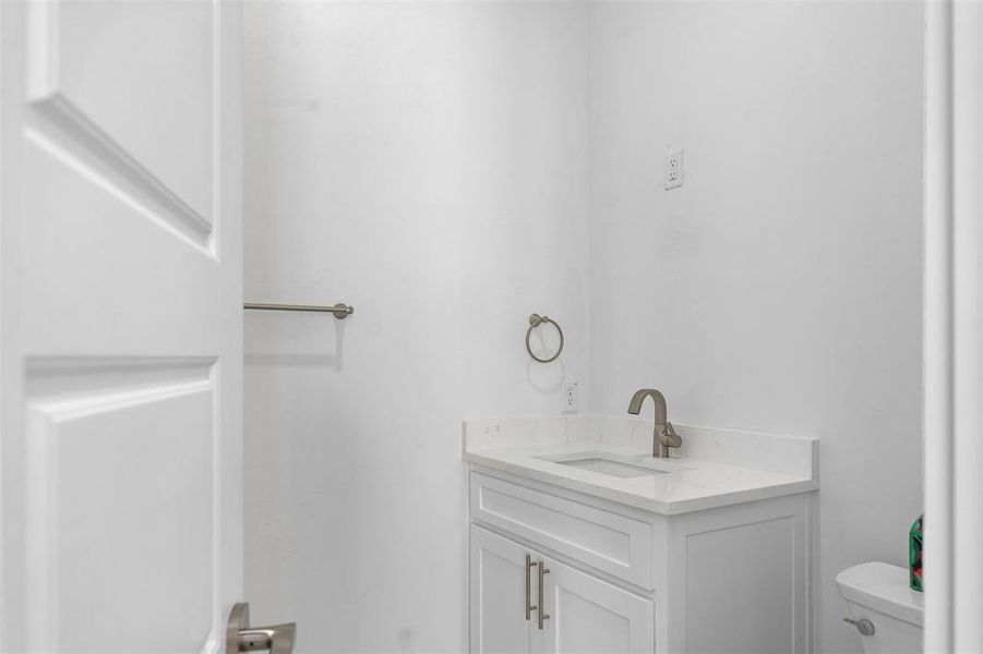 Bathroom with vanity and toilet