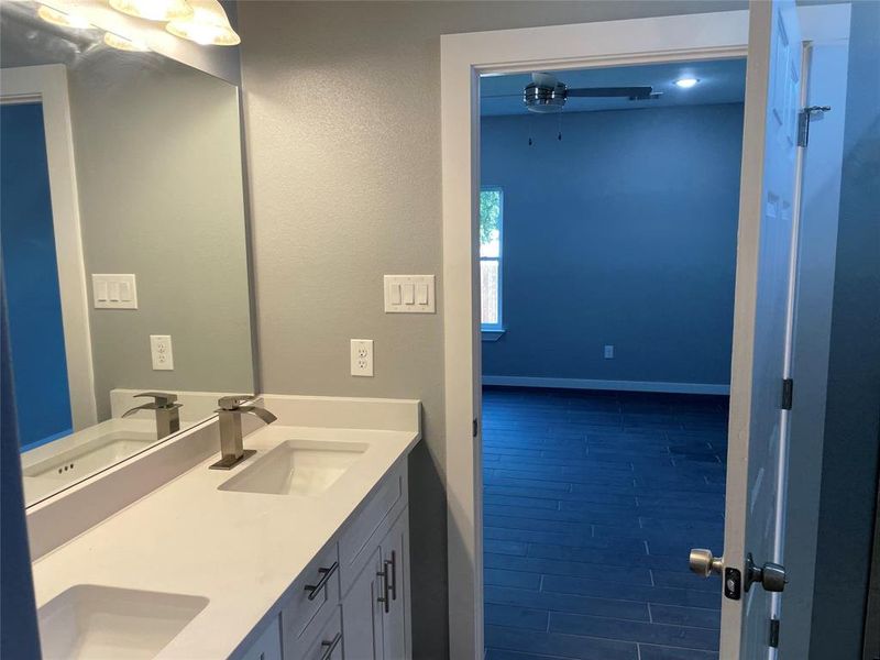 Bathroom with vanity and hardwood / wood-style floors