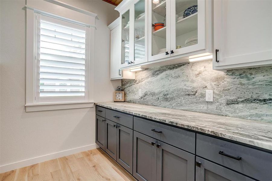 Butler pantry with ample storage.