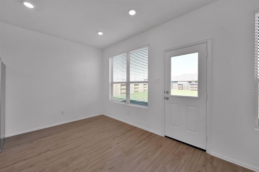 Breakfast room overlooking the huge back yard and brand new 10x20 patio