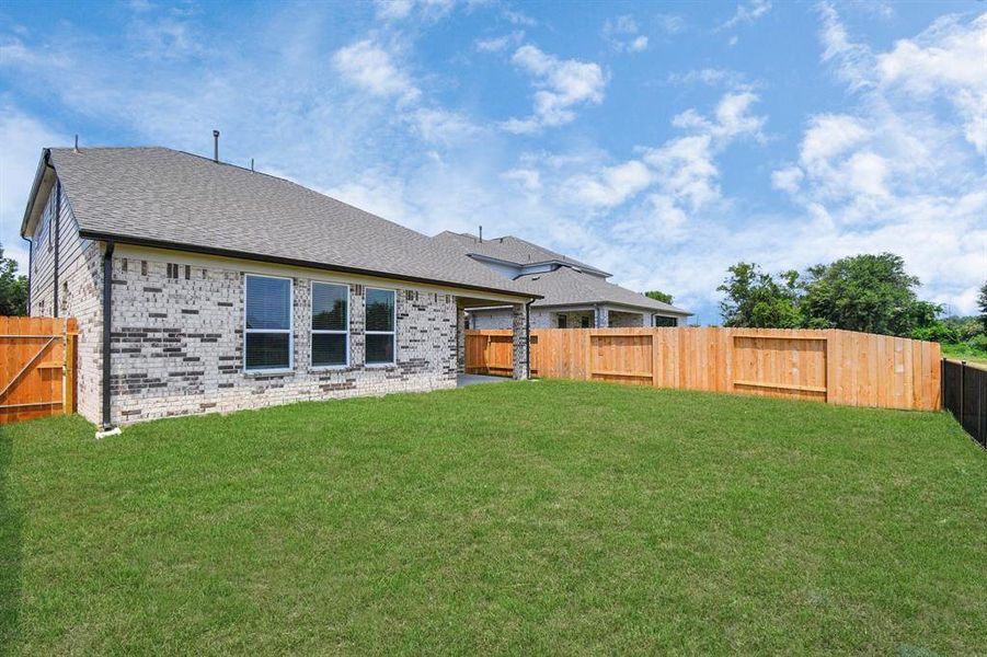 Backyard retreat, offering an abundance of space for kids to play and explore. The possibilities are endless in this open space.