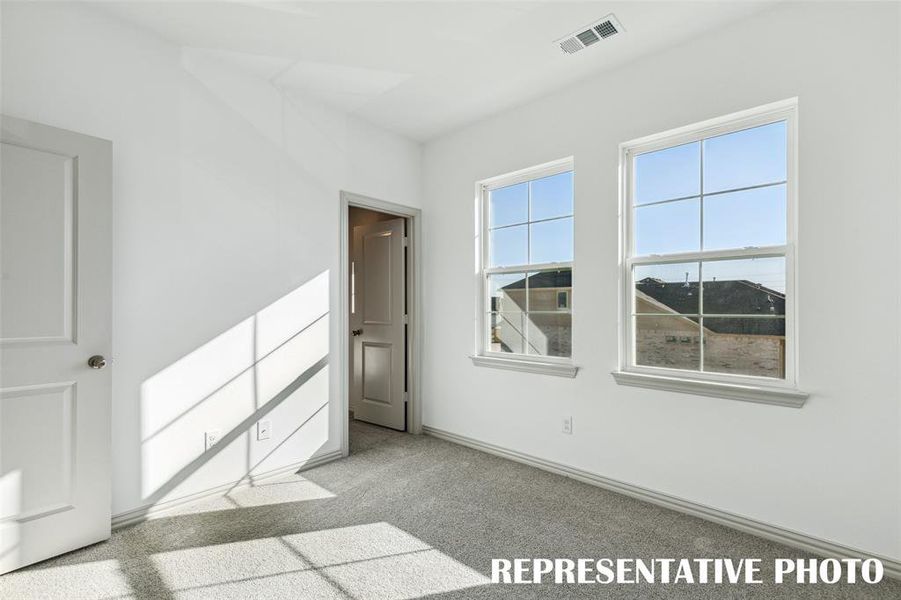 One of two nicely sized secondary bedrooms in our Mia plan.  REPRESENTATIVE PHOTO