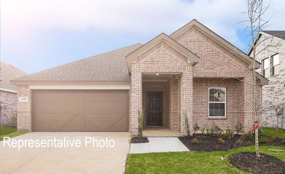 View of front of home featuring a garage