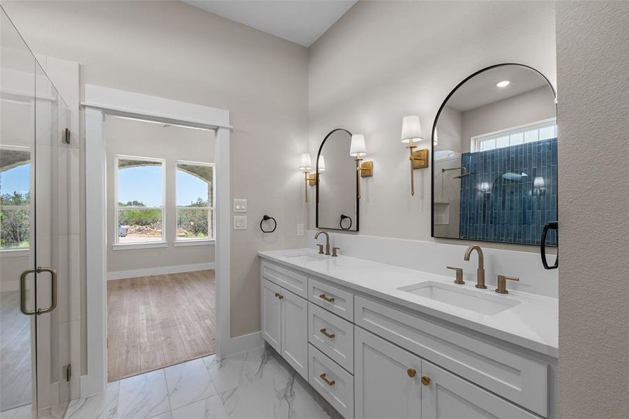 Bathroom with vanity, a shower with shower door, and hardwood / wood-style floors