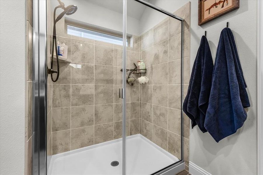 Bathroom featuring a shower with shower door