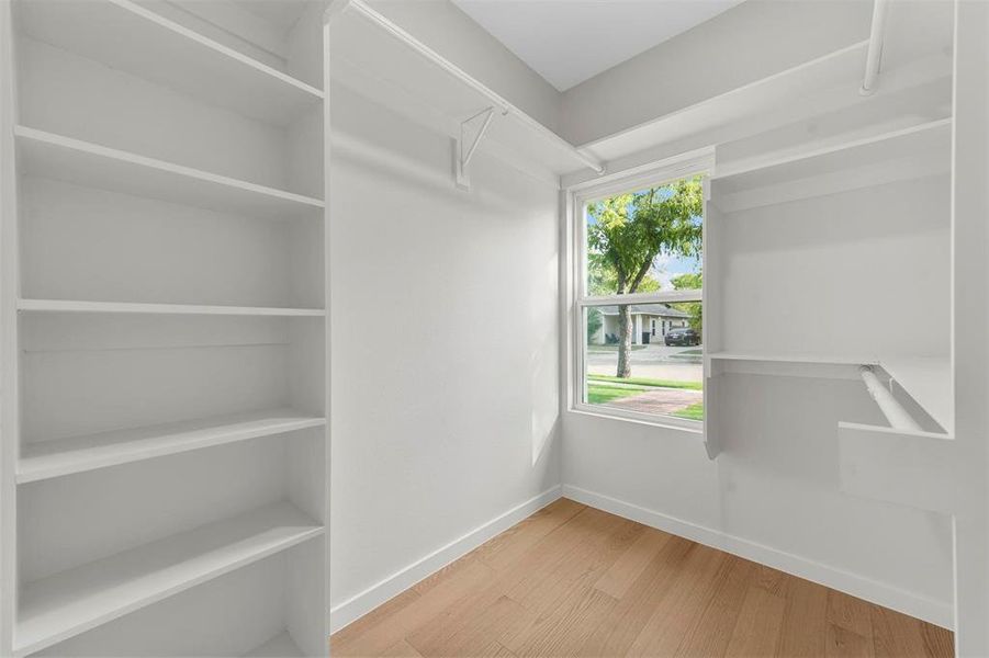 Walk in closet featuring hardwood / wood-style flooring