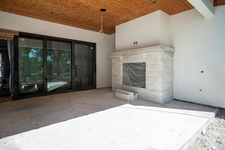 Outdoor living space with Fireplace and future Built-in Grill.