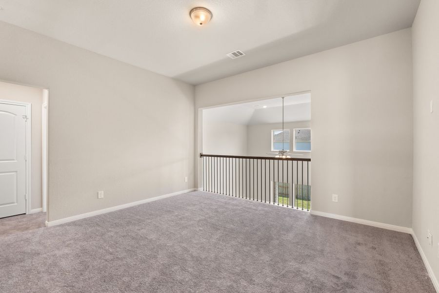 An additional view of the game room with a view of the two story family room