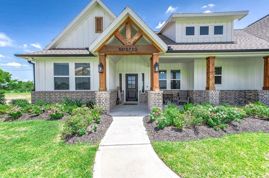 Beautiful porch with views to the neighborhood lake.