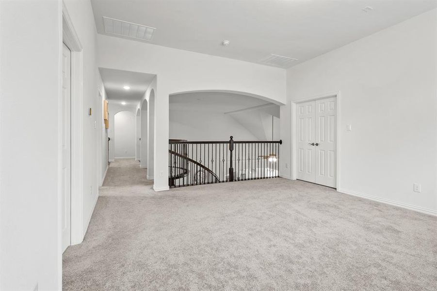 Spare room featuring light colored carpet