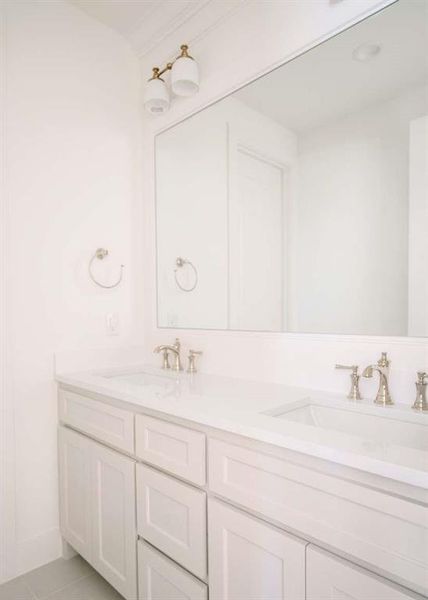 Bathroom with tile patterned flooring and vanity