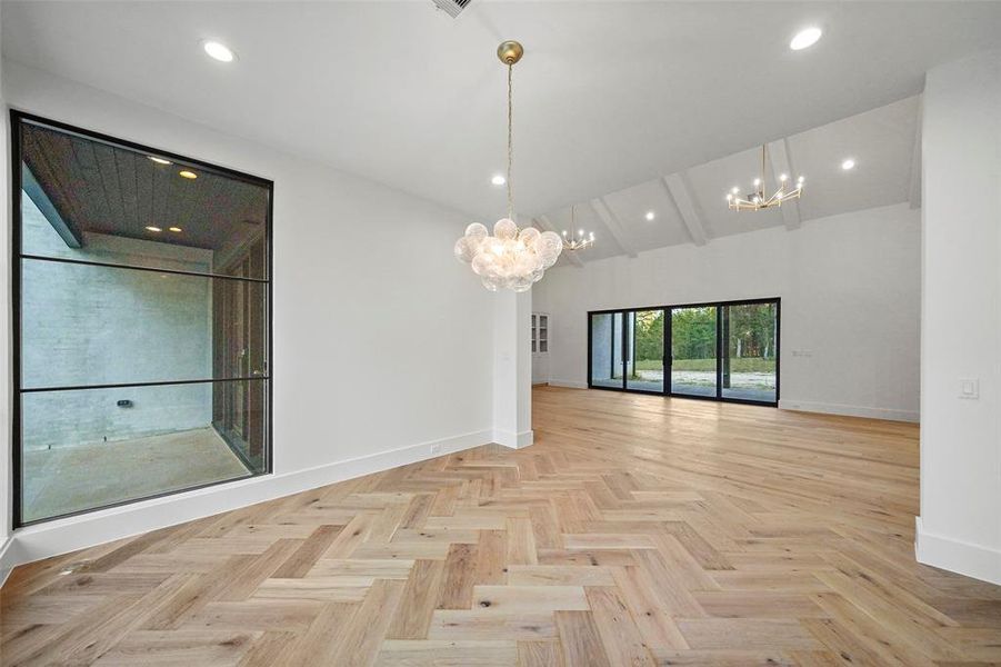 Formal living or dining featuring European French oak floors in herringbone.