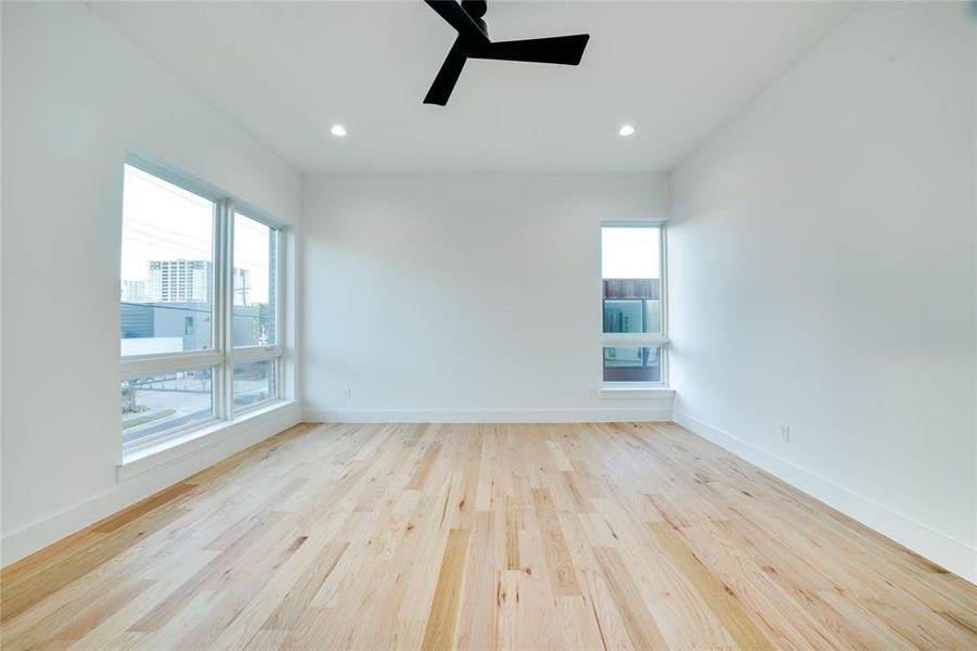 Empty room featuring light hardwood / wood-style floors and ceiling fan