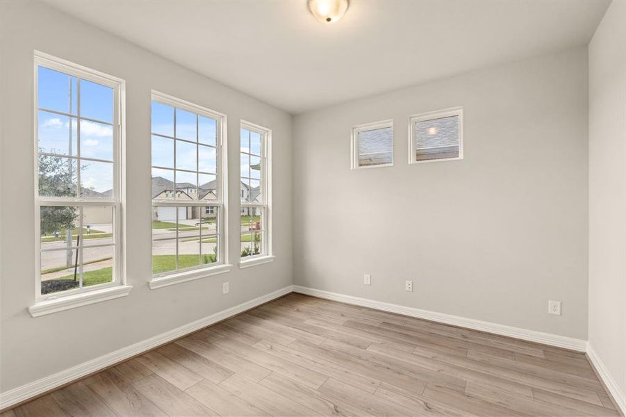 The home office features French doors, beautiful floors, large windows that give a fresh feel, this space promotes focus and creativity.