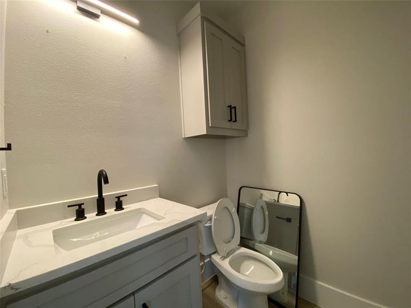 Bathroom featuring toilet and vanity